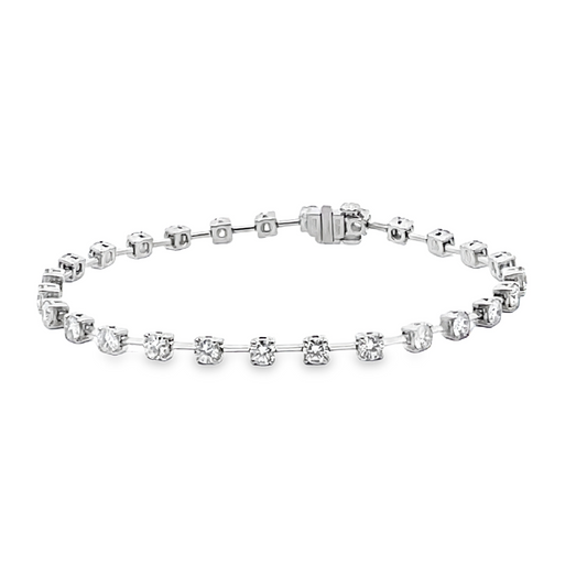 Platinum wire bracelet set with (27) round diamonds totaling 3.03cts,