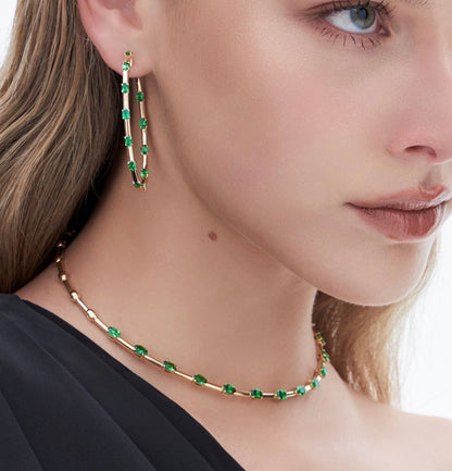18K yellow gold collar necklace set with (13) oval green tsavorite tot